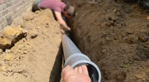 Looking for Professional Sewer Line Repair in Normal IL? We Can Help! 1 Crew installing a new sewer line during professional sewer line installation and excavation. Sewer Line Repair In Normal IL