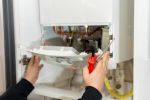 Water Heater Repair Bloomington IL 1 A technician performs repairs after someone searched for Water Heater Repair Bloomington IL